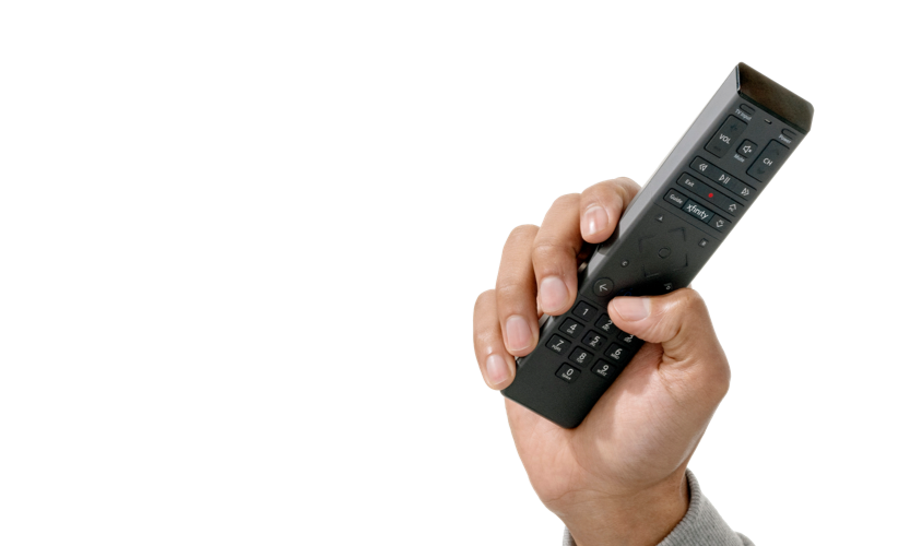 Hand holding a remote with the voice command: Xfinity in my Community